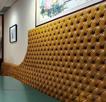 Yellow tufted booth seating along the wall at Miriwa Restaurant