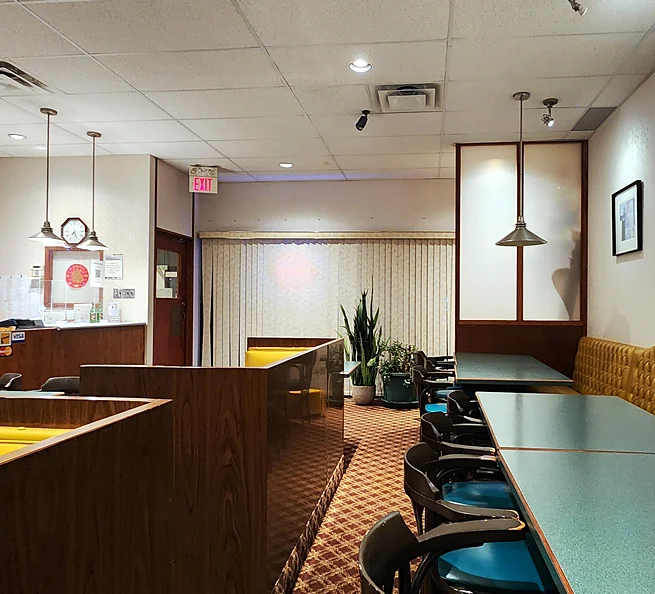 Miriwa Restaurant dining room with booths, tables and pendant lights